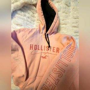 pink and black embroidered hollister hoodie